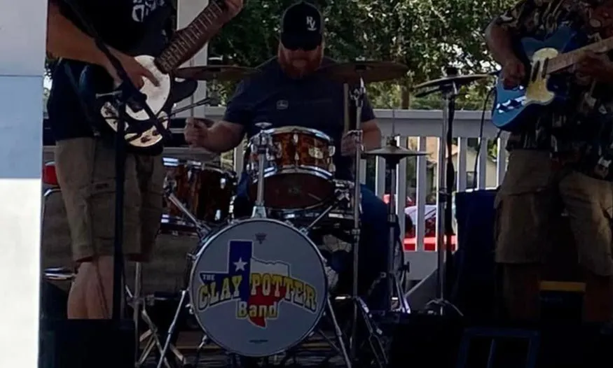 Jason Voirin — Drums & Background Vocals Jason Voirin playing drums behind the Clay Potter Band kit on stage