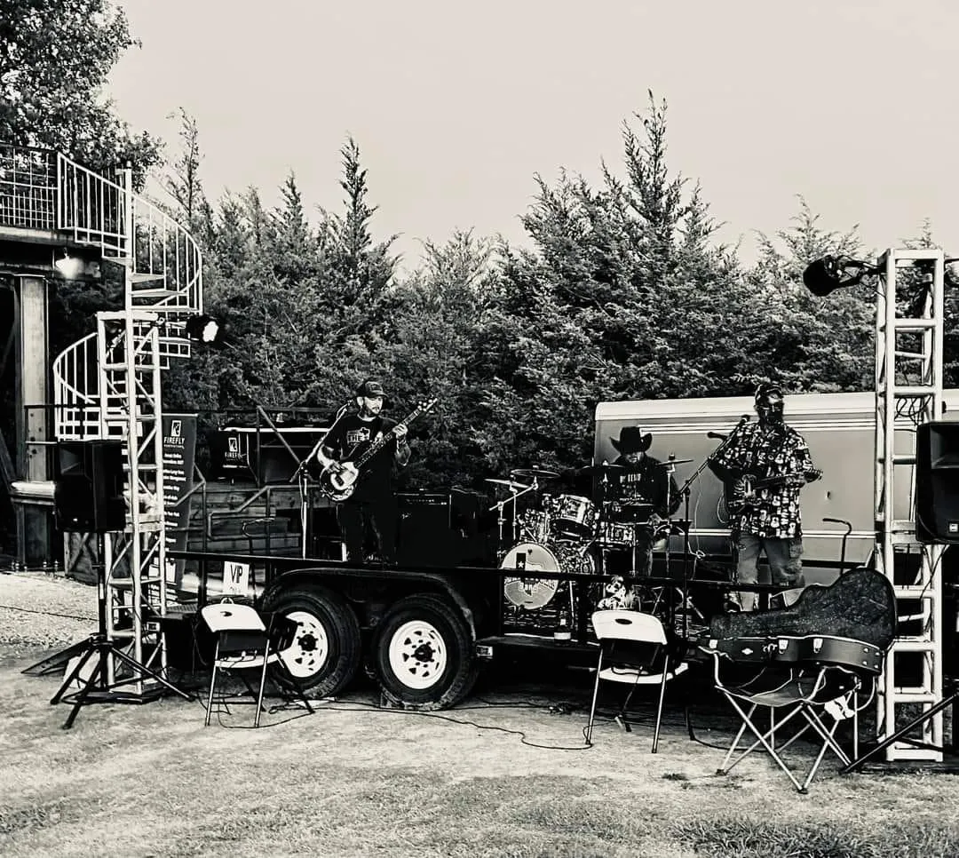 The Clay Potter Band set up and playing on their mobile stage trailer at a Texas outdoor venue The Clay Potter Band set up and playing on their mobile stage trailer at a Texas outdoor venue